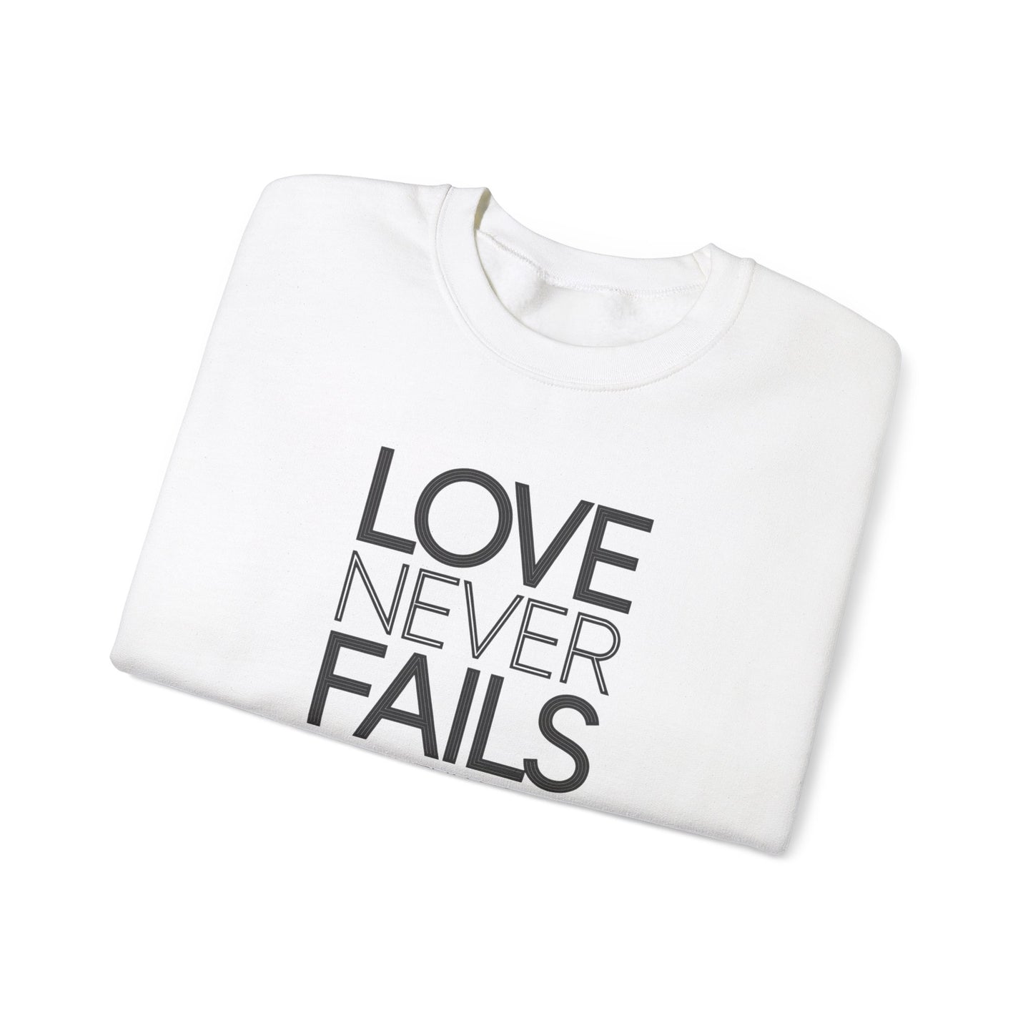 Love Never Fails  Unisex Heavy Blend™ Crewneck Sweatshirt