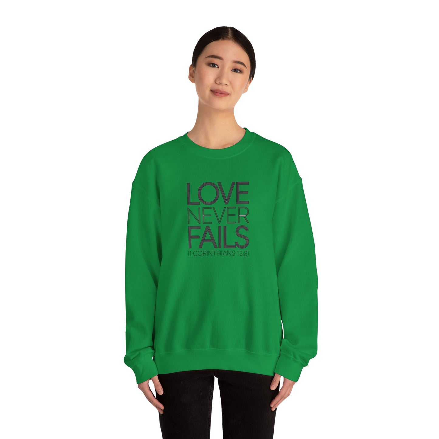 Love Never Fails  Unisex Heavy Blend™ Crewneck Sweatshirt