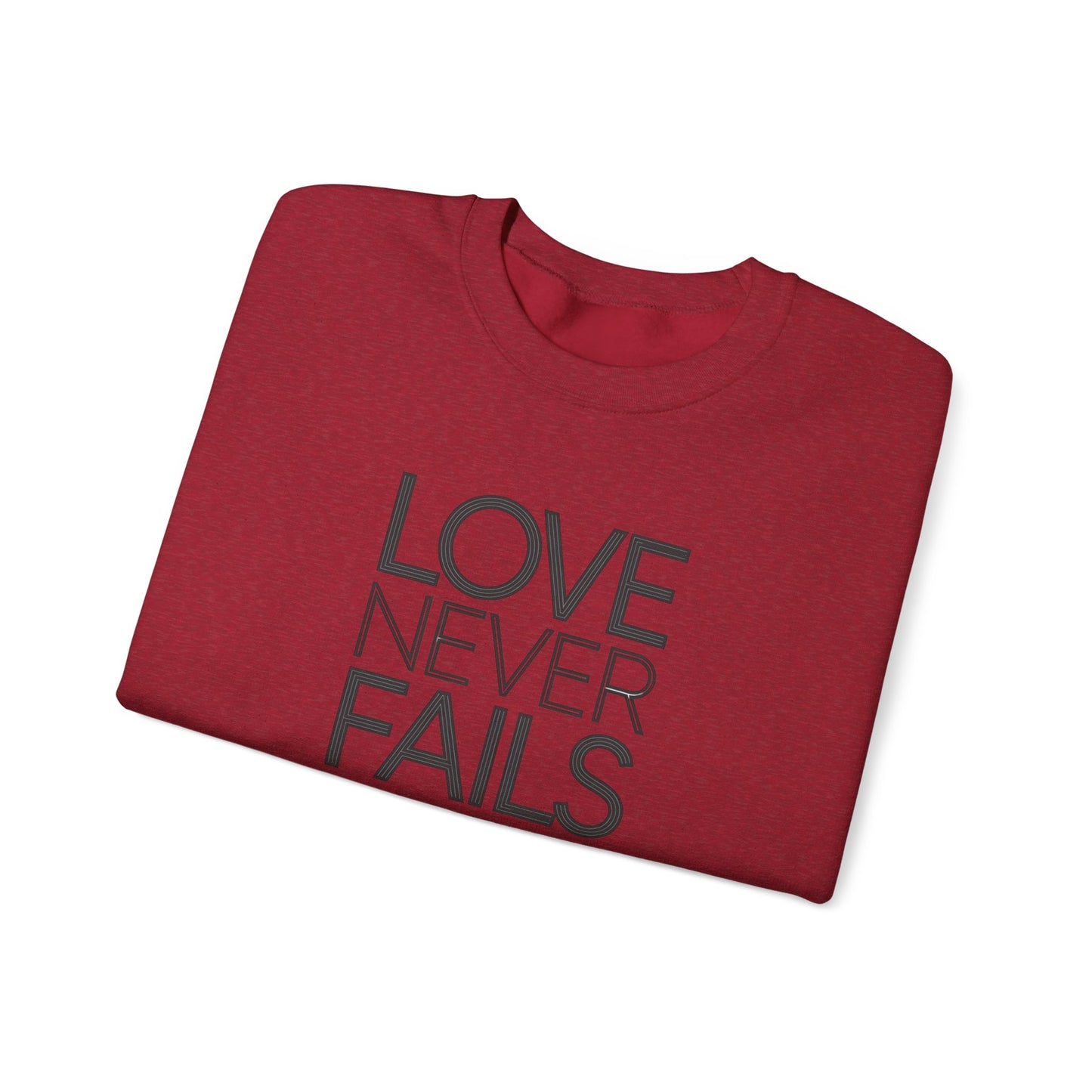 Love Never Fails  Unisex Heavy Blend™ Crewneck Sweatshirt