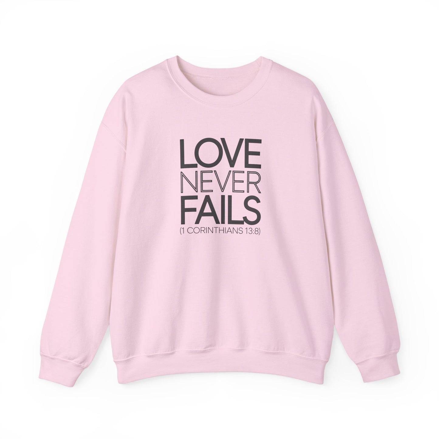 Love Never Fails  Unisex Heavy Blend™ Crewneck Sweatshirt