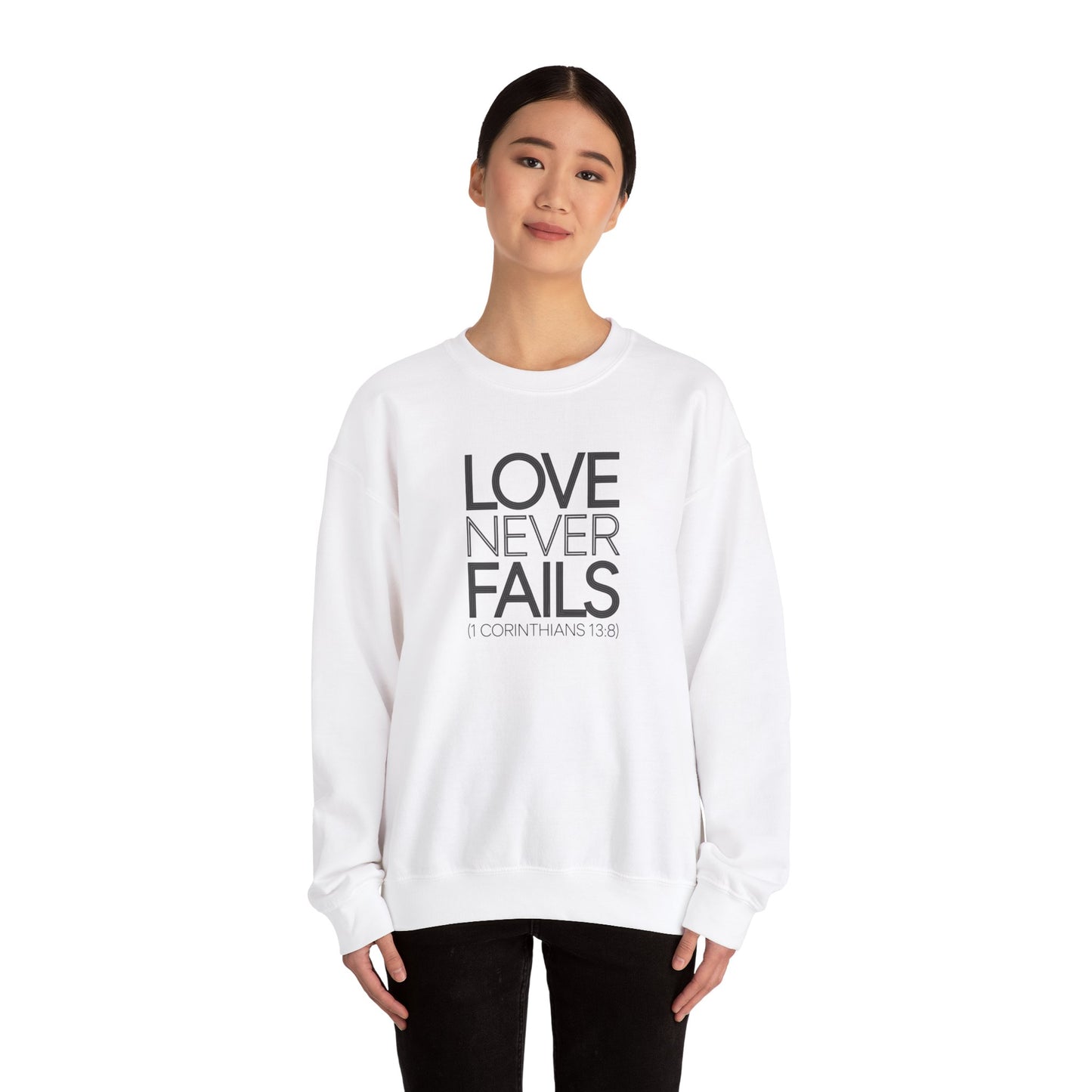 Love Never Fails  Unisex Heavy Blend™ Crewneck Sweatshirt