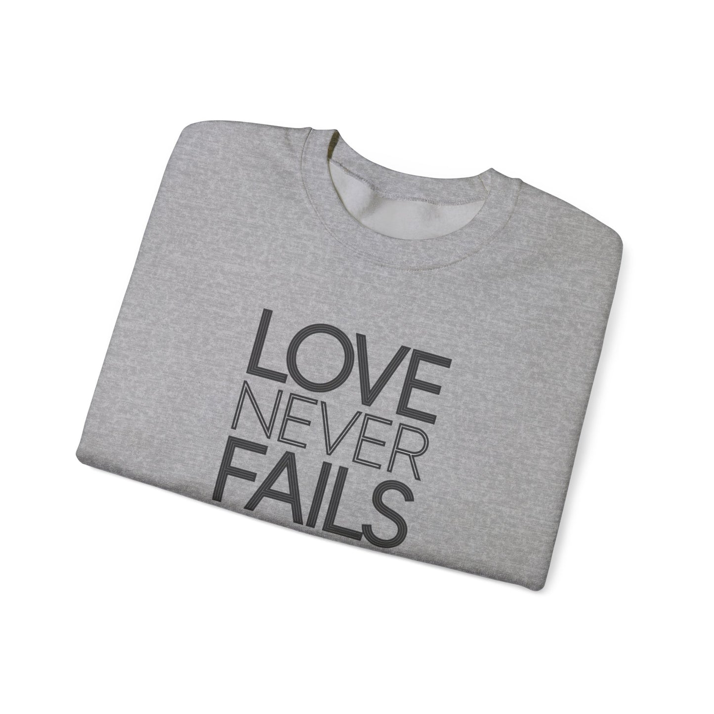 Love Never Fails  Unisex Heavy Blend™ Crewneck Sweatshirt